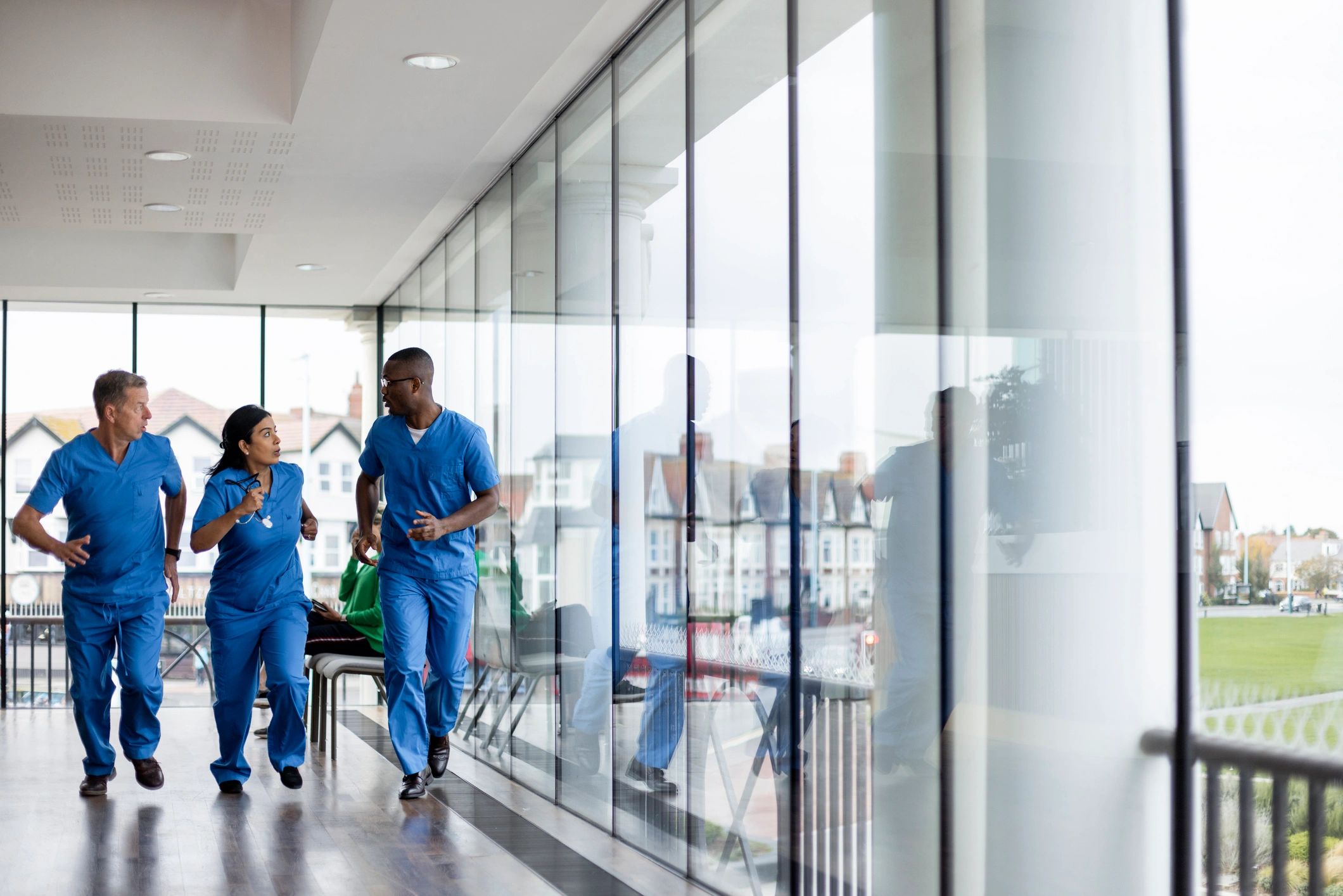 Healthcare professionals in a hospital corridor