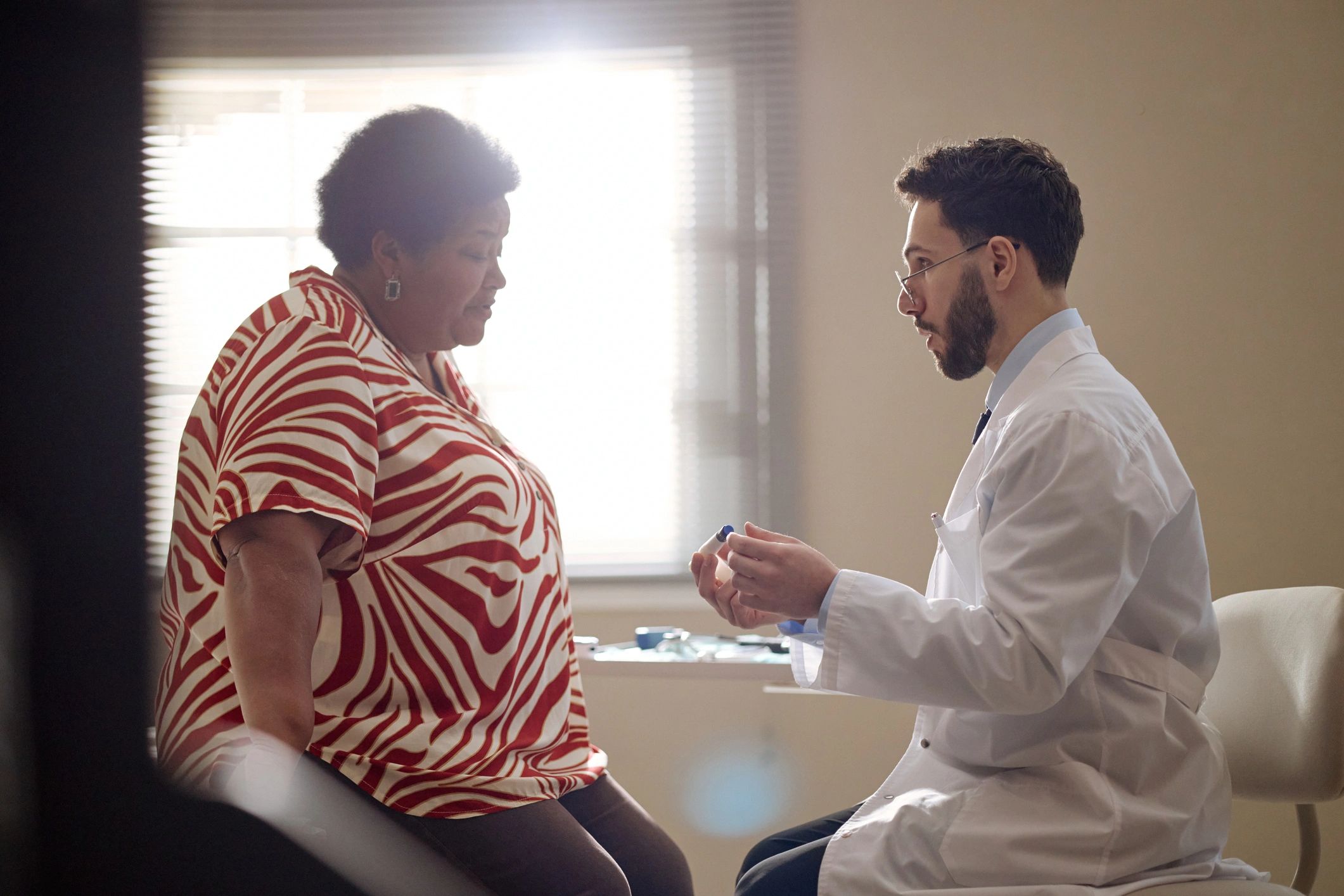 Patient consulting with a doctor in a clinic